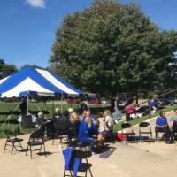 GVSU volleyball alumni, friends, and family outside at a tailgate